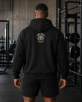 AI-generated gym lifestyle visualisation — Lion Crest black hoodie, back view. Refer to supplier mockups for garment details.