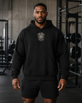 AI-generated gym lifestyle visualisation — Lion Crest black hoodie, front view. Refer to supplier mockups for garment details.